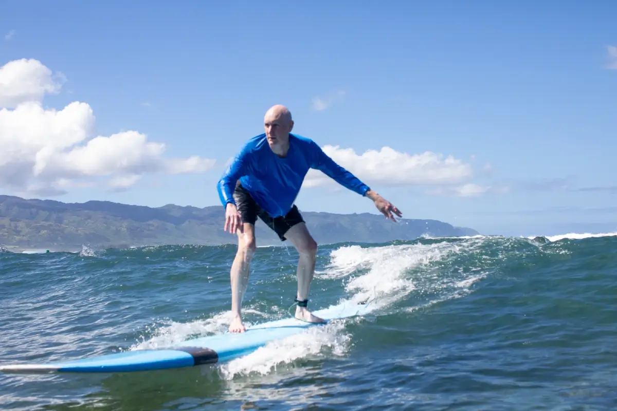Hawaii surfing lesson at Puaʻena Point, a beginner-friendly surf spot on Oahu's North Shore. Get surfer lessons for beginners, book online now.